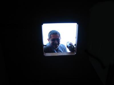A scary face in a portal of light