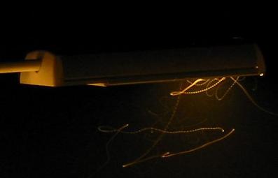 Flies lit by streetlamp