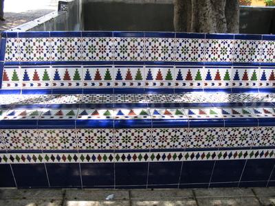 Ornate patterns on a park bench.