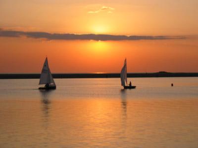 Boat silhouettes at sunset