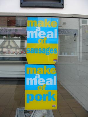 Signs in butcher window