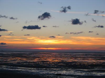 Clouds silhouetted against a sunset