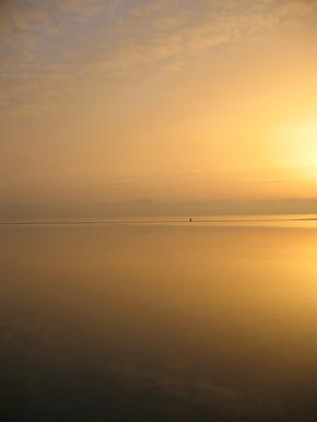 Distant figure in sunset