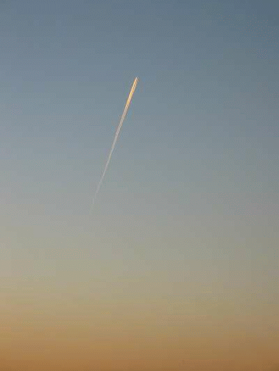 Aircraft contrail at sunset
