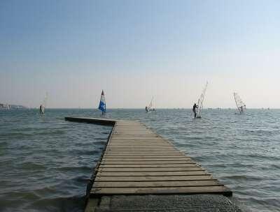 Windsurfers and jetty