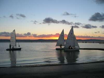 Boats at the jetty at sunset
